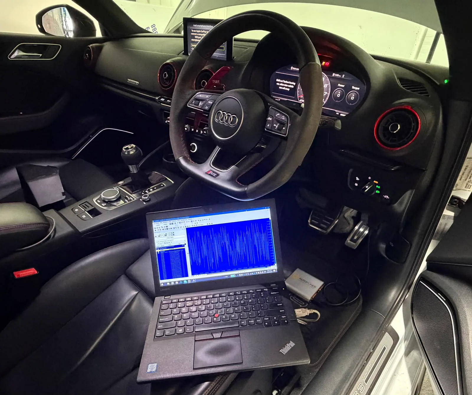 Laptop connected to an Audi for custom ECU and gearbox calibration